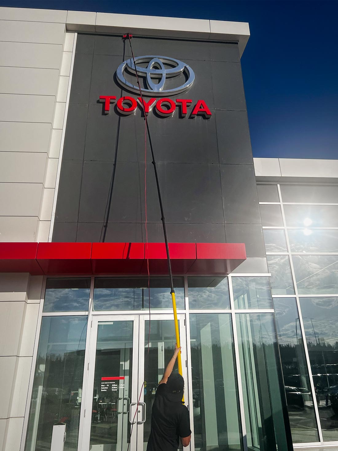 Window cleaning Toyota Dealership with high pole